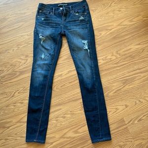Express mid rise legging jeans. Slightly distressed look